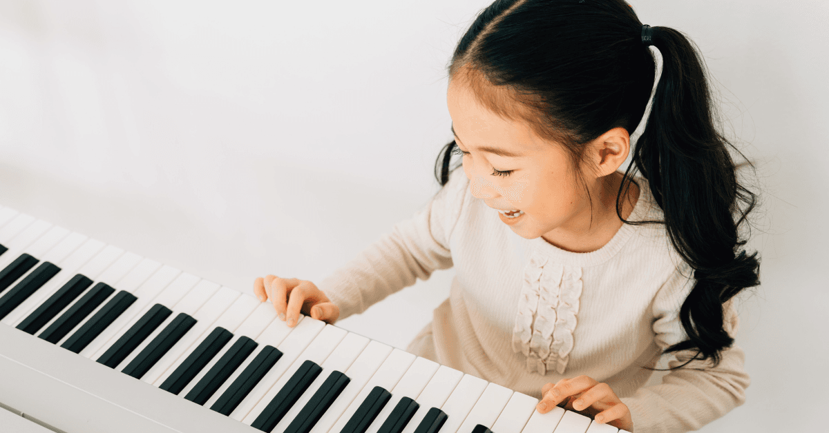 Kids playing piano at Exceed Learning Center