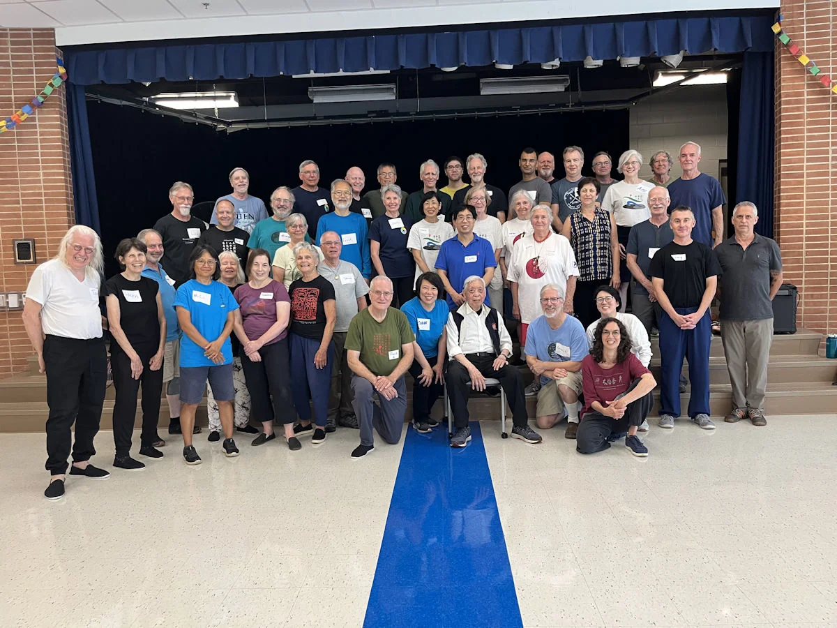 A large Tai Chi Chuan group gathered for a class photo