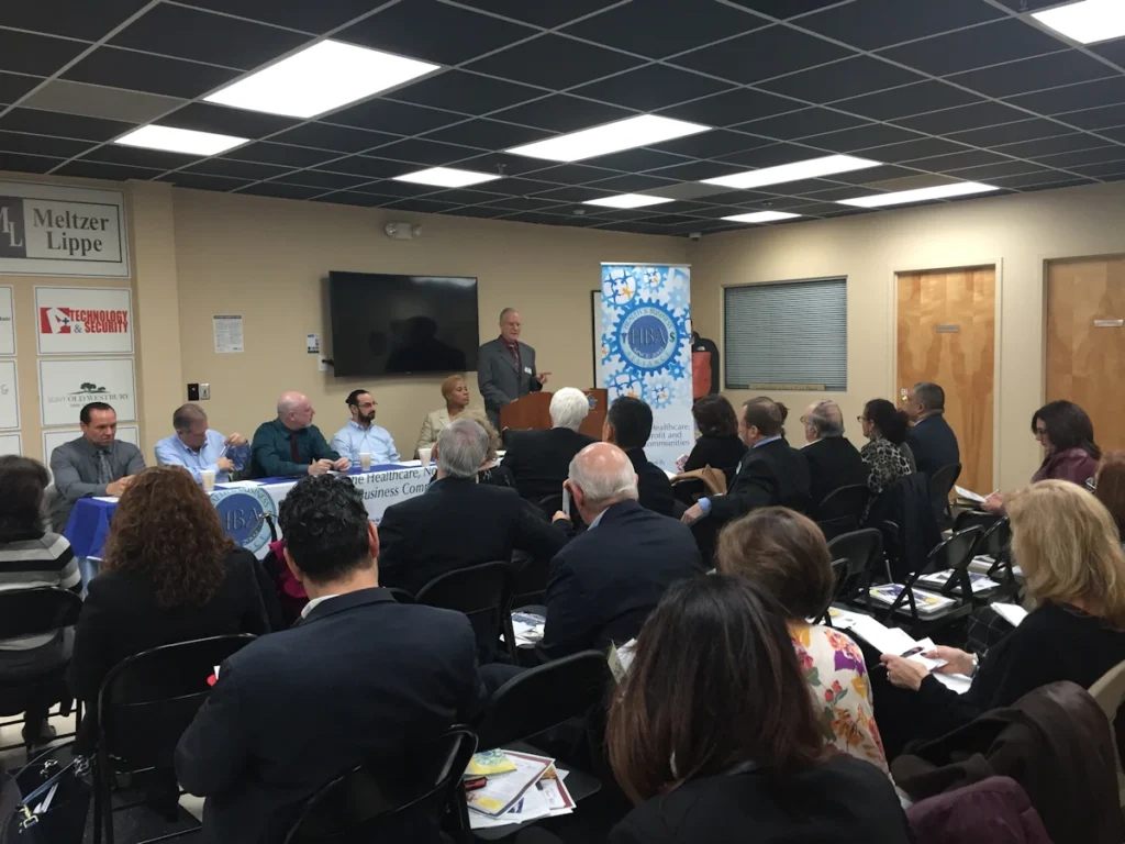 David B. Alexander speaking at a Health and Business Alliance meeting
